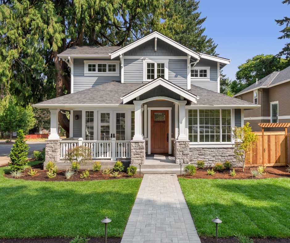 Gray Craftsman house with front porch and lawn - https://www.amherstins.com/