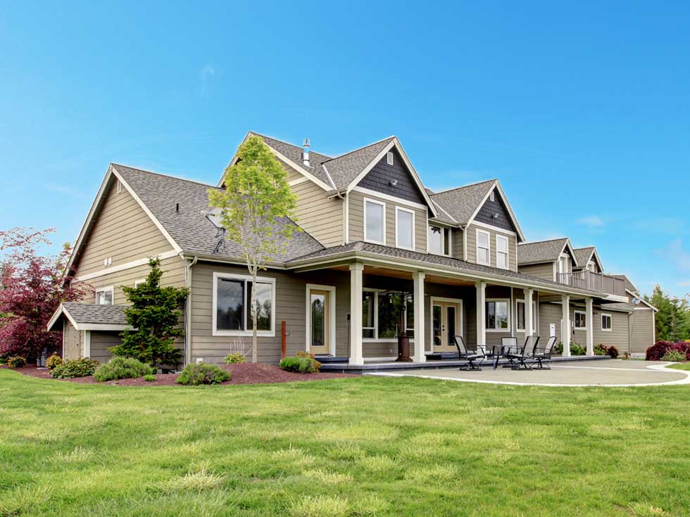 Large modern suburban house with covered front porch - https://www.amherstins.com/